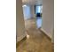 Entryway with tile flooring leading to the living room at 2333 Feather Sound Dr # A101, Clearwater, FL 33762