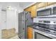 Kitchen with stainless steel appliances and granite countertops at 2333 Feather Sound Dr # A101, Clearwater, FL 33762