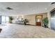 Building lobby with tile floors and elevator access at 2333 Feather Sound Dr # A101, Clearwater, FL 33762