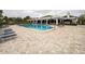 Community pool with plenty of lounge chairs at 2333 Feather Sound Dr # A101, Clearwater, FL 33762