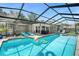 Screened pool area with a pool, outdoor seating and landscaping at 1390 Eastfield Dr, Clearwater, FL 33764
