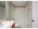 Clean bathroom with a tub, shower, and vanity with sink at 7707 N Riverdale Ave, Tampa, FL 33604
