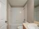 Clean bathroom with a tub, shower, and vanity at 7707 N Riverdale Ave, Tampa, FL 33604