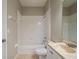 Clean bathroom with a tub, shower, and vanity at 7707 N Riverdale Ave, Tampa, FL 33604