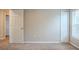 Neat bedroom with carpet, double door closet, and window at 7707 N Riverdale Ave, Tampa, FL 33604