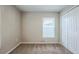 Bedroom with neutral walls, carpet, window, and closet at 7707 N Riverdale Ave, Tampa, FL 33604