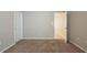 Bedroom with carpet flooring and access to another room at 7707 N Riverdale Ave, Tampa, FL 33604