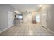 Open dining area with tile floors and access to kitchen at 7707 N Riverdale Ave, Tampa, FL 33604