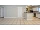 Kitchen with white cabinets, black appliances, and granite counters at 7707 N Riverdale Ave, Tampa, FL 33604