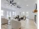 Sunlit living room with hardwood floors and a cozy fireplace at 5116 11Th W Ave, Bradenton, FL 34209