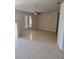 Spacious living room with tile flooring and ceiling fan at 9116 Castlehill Ave, Englewood, FL 34224