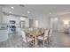 Kitchen and dining area with a large wooden table at 11223 Spring Gate Trl, Bradenton, FL 34211