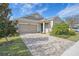 One story home with a two-car garage and paver driveway at 11223 Spring Gate Trl, Bradenton, FL 34211