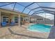 Inviting pool area with covered patio and seating at 11223 Spring Gate Trl, Bradenton, FL 34211