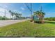 Inviting community entrance with palm trees and waterfront views at 3301 Alt 19 Lot 819, Palm Harbor, FL 34683