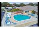 Community pool with plenty of lounge chairs for relaxing at 3301 Alt 19 Lot 819, Palm Harbor, FL 34683