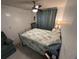 Bedroom with double bed and ceiling fan at 3301 Alt 19 Lot 819, Palm Harbor, FL 34683