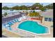 Relaxing community pool with surrounding lounge chairs at 3301 Alt 19 Lot 819, Palm Harbor, FL 34683