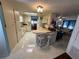 Galley style kitchen with a breakfast bar and view to dining area at 3301 Alt 19 Lot 819, Palm Harbor, FL 34683