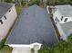 An overhead view of the home's roof and the neighborhood at 4311 Rustic Pine Pl, Wesley Chapel, FL 33544