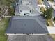 House's roof and backyard from an aerial perspective at 4311 Rustic Pine Pl, Wesley Chapel, FL 33544