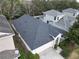 Aerial view showcasing the house's roofline and surrounding homes at 4311 Rustic Pine Pl, Wesley Chapel, FL 33544