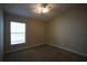 Bright bedroom featuring a window with blinds and ceiling fan at 4311 Rustic Pine Pl, Wesley Chapel, FL 33544