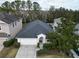 One-story house with a two-car garage, landscaping, and driveway at 4311 Rustic Pine Pl, Wesley Chapel, FL 33544