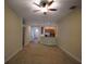 Spacious living room with carpet flooring and neutral walls at 4311 Rustic Pine Pl, Wesley Chapel, FL 33544