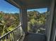 Private screened balcony overlooking trees and sky at 5707 Legacy Crescent Pl # 303, Riverview, FL 33578