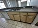 Light wood kitchen cabinets and gray countertops at 5707 Legacy Crescent Pl # 303, Riverview, FL 33578