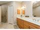 Bathroom boasts dual sinks, a large mirror, and a walk-in shower at 7313 Emma Rd, Bradenton, FL 34209