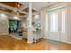 Bright entryway with hardwood floors and a view into living room at 7313 Emma Rd, Bradenton, FL 34209