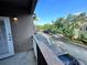 Balcony with view of parking lot and trees at 10412 Villa View Cir, Tampa, FL 33647