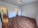 Bright bedroom featuring laminate floors and en-suite bathroom access at 10412 Villa View Cir, Tampa, FL 33647