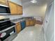 Modern kitchen with stainless steel appliances and light wood cabinets at 10412 Villa View Cir, Tampa, FL 33647