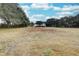 Farmhouse on large lot with surrounding trees and pasture at 6936 Handcart Rd, Wesley Chapel, FL 33545