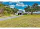 Rustic barn with large open doors on a rural property at 6936 Handcart Rd, Wesley Chapel, FL 33545