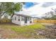 Newly renovated home with a backyard and wooden fence at 1502 10Th W St, Bradenton, FL 34205