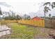 Backyard with a wooden fence and patchy lawn at 1502 10Th W St, Bradenton, FL 34205