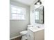 Updated bathroom with a vanity, toilet, and a shower/tub combo at 1502 10Th W St, Bradenton, FL 34205