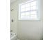 Clean bathroom with a shower and window for natural light at 1502 10Th W St, Bradenton, FL 34205