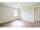 Simple bedroom with wood-look floors and a window at 1502 10Th W St, Bradenton, FL 34205