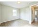 Well-lit bedroom with wood-look floors and a window at 1502 10Th W St, Bradenton, FL 34205