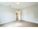 Spacious bedroom featuring light walls, wood-look floors, and an adjacent bathroom at 1502 10Th W St, Bradenton, FL 34205