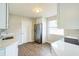 Modern kitchen with white cabinets, stainless steel appliances, and quartz countertops at 1502 10Th W St, Bradenton, FL 34205