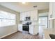 Modern kitchen featuring white shaker cabinets, stainless steel appliances, and quartz countertops at 1502 10Th W St, Bradenton, FL 34205