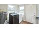 Laundry room with washer, dryer, and extra storage space at 1502 10Th W St, Bradenton, FL 34205