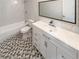 Modern bathroom with white vanity and hexagon tile floor at 1505 Larkin Rd, Spring Hill, FL 34608