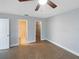 Spacious bedroom with tile floors and ample closet space at 1505 Larkin Rd, Spring Hill, FL 34608